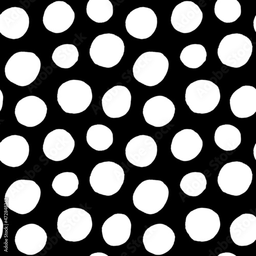 Polka dots, hand drawn spots seamless vector pattern. Scattered big and small circles, points in various sizes. Monochrome retro background. Decorative black and white design tiles.