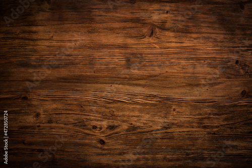 Illuminated brown wooden surface. Wood texture - Background for christmas and advent season with space for text. Top view.