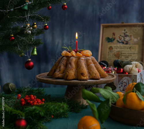 A festive cupcake with a candle. Festive cupcake for Christmas, New Year, Thanksgiving. Festive still life.