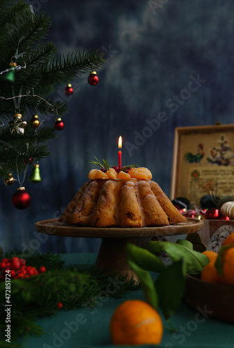 A festive cupcake with a candle. Festive cupcake for Christmas, New Year, Thanksgiving. Festive still life.