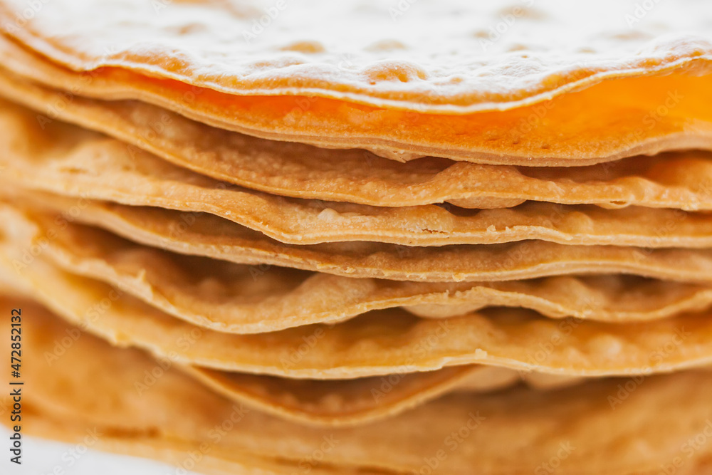 Layers of baked crumpets cakes made of puff pastry for cake. Semi-finished product for cake. Layers of baked crumpets cakes made of puff pastry for cake. Semi-finished product for cake.