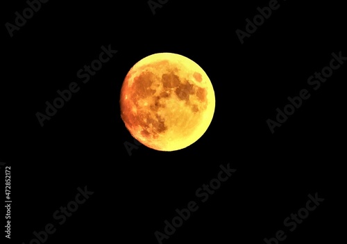 Big red moon on the dark night sky