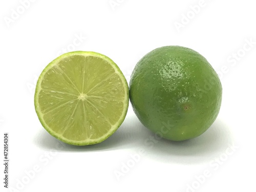 Tahiti lemon from Brazil cut on white background.