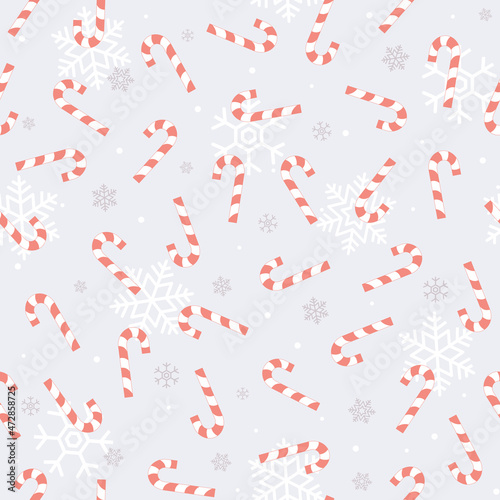 Purple  Christmas seamless pattern with blue candy cane and snowflakes