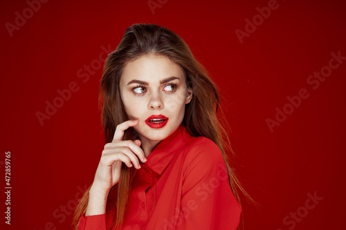 woman in red shirt posing fashion red lips fun