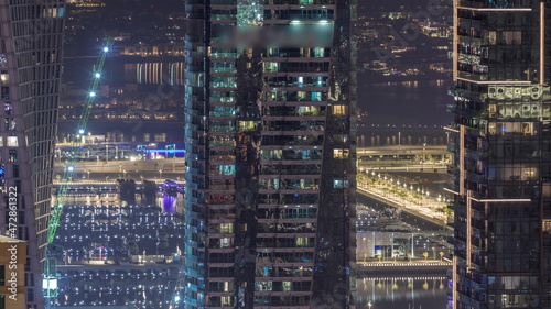 Canal in Dubai Marina with luxury skyscrapers around night timelapse, United Arab Emirates © neiezhmakov
