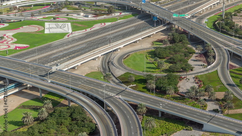 Aerial view on Dubai Marina with big highway intersection timelapse and skyscrapers around, UAE