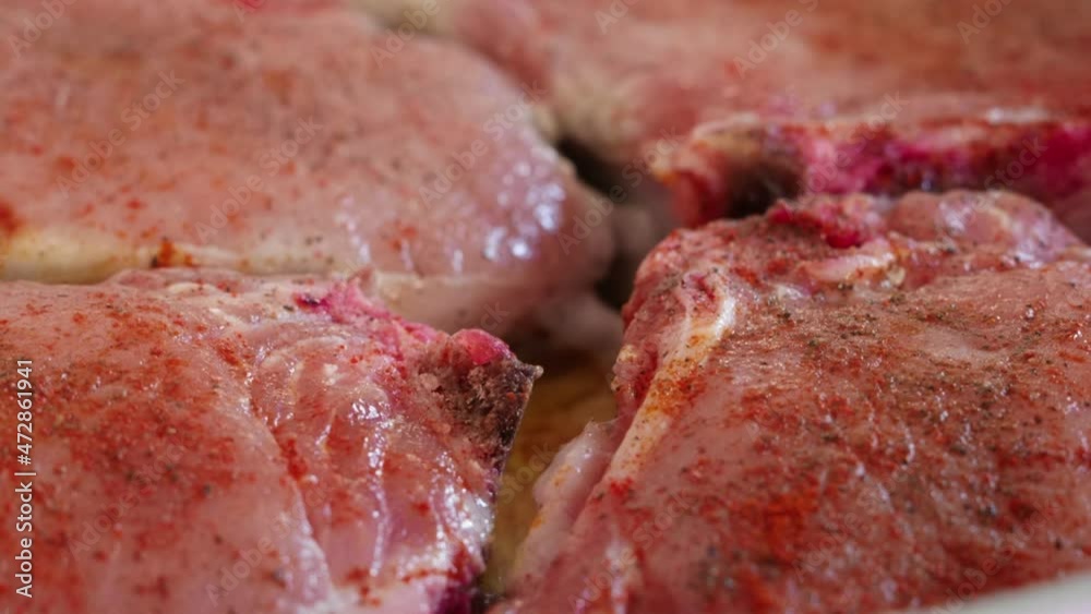 fresh pork chops frying in vegetable oil pan closeup