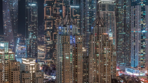 Skyscrapers of Dubai Marina with highest residential buildings all night timelapse