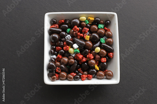 Small colored chocolates. Glazed chocolate. Sweet dragee stones. Desserts for Candy Bar. Small multi-colored candies.