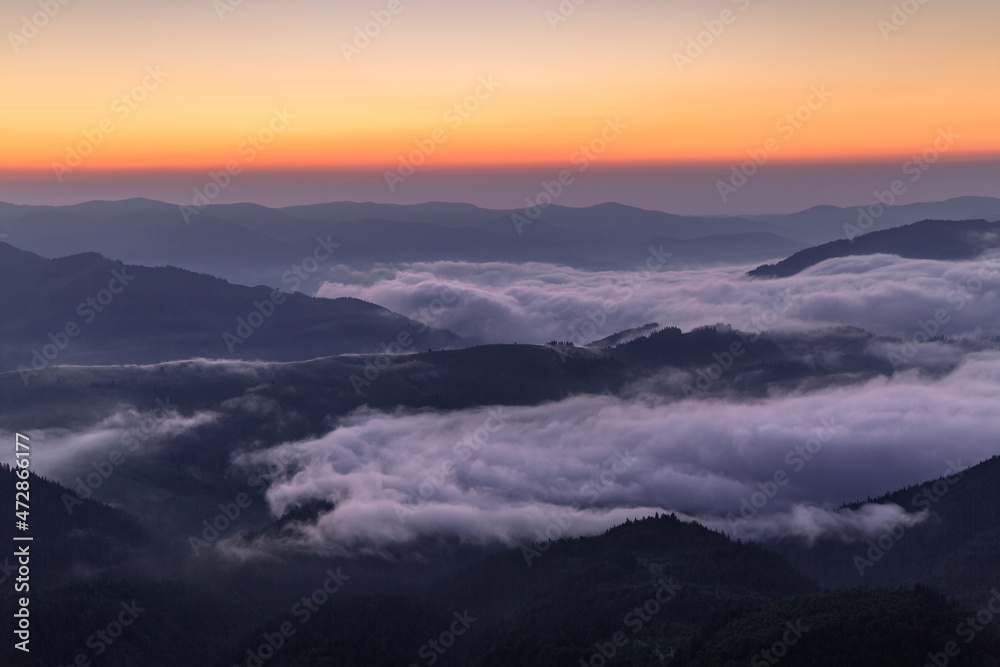 Fototapeta premium Sunrise on the foggy morning. Landscape with high mountains. Touristic place. Natural scenery. Location Carpathian, Ukraine, Europe. Wallpaper background.