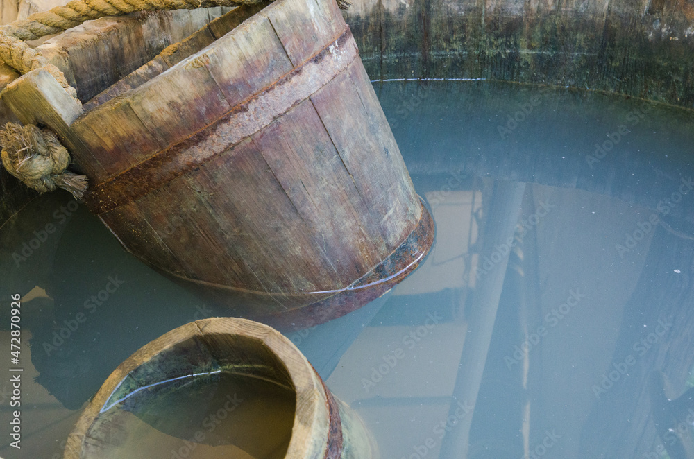 Rustic Wooden Whiskey Barrels Bucket In the water Rustic Wooden Whiskey Barrels Bucket In the water