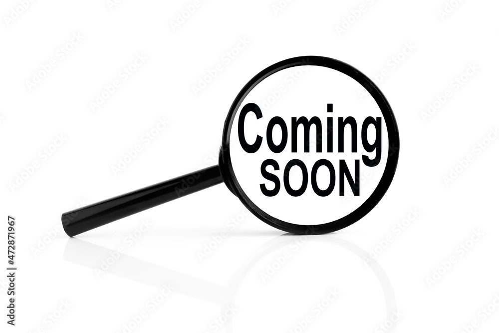 COMING SOON. text inside the magnifier. magnifying glass on white background COMING SOON. text inside the magnifier. magnifying glass on white background