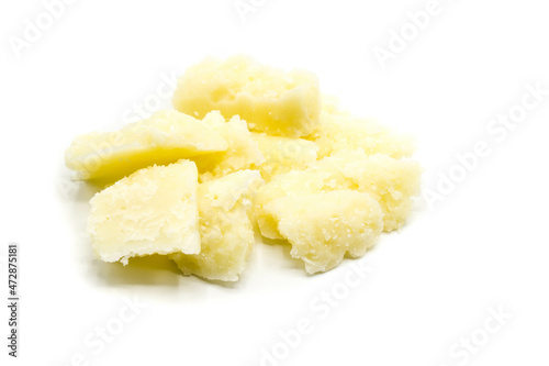 Piece of parmesan cheese isolated on white background
