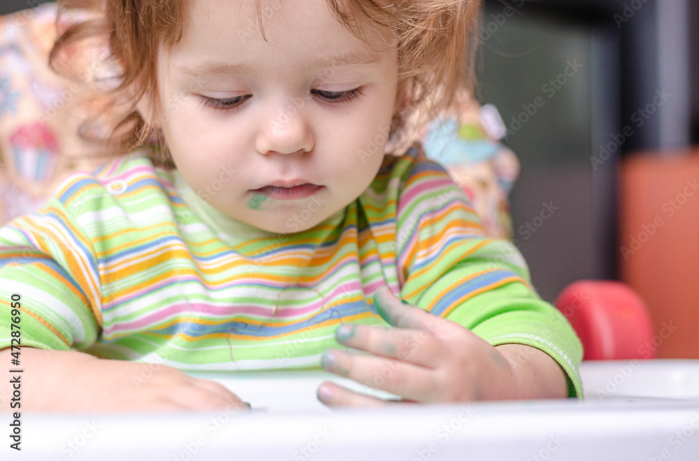 The concept of children's creativity. Dirty baby painting The concept of children's creativity. Dirty baby painting