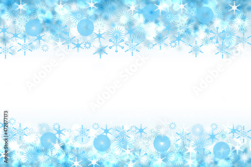 Abstract blurred festive winter christmas or Happy New Year background with shiny blue and white bokeh lighted stars. Space for your design. Card concept.