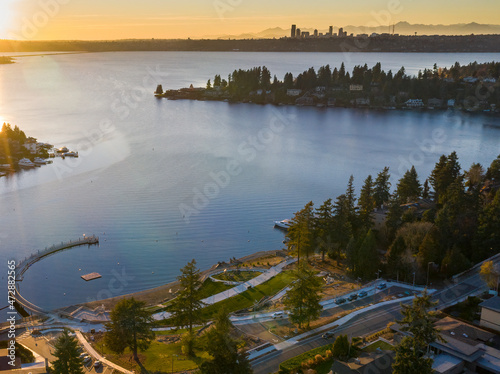 USA, Washington State, Bellevue. Meydenbauer Park, Meydenbauer Bay, and Seattle skyline at sunset. photo