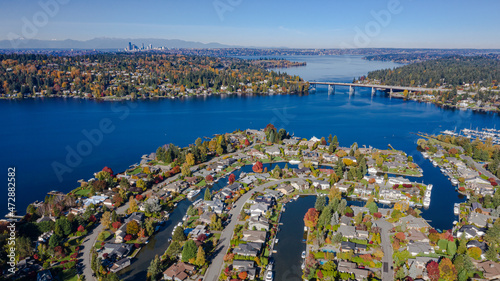 USA, Washington State, Bellevue. Newport Shores neighborhood, Lake Washington and SR520 floating bridge in autumn, with Seattle in distance. photo