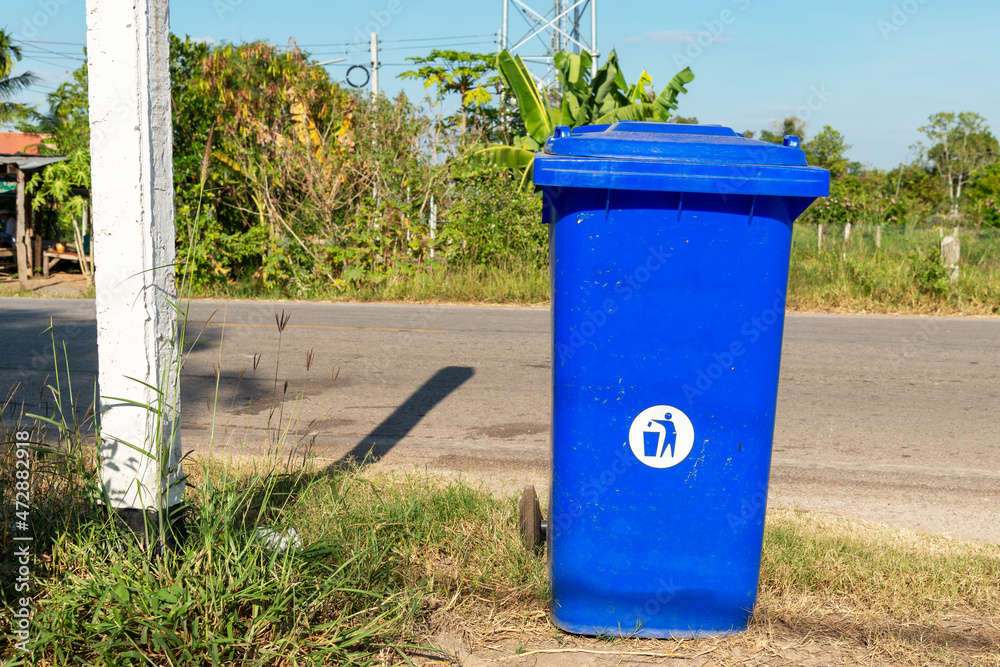 Blue recycle bin at road side, garbage bins in outdoor. Blue recycle bin at road side, garbage bins in outdoor.
