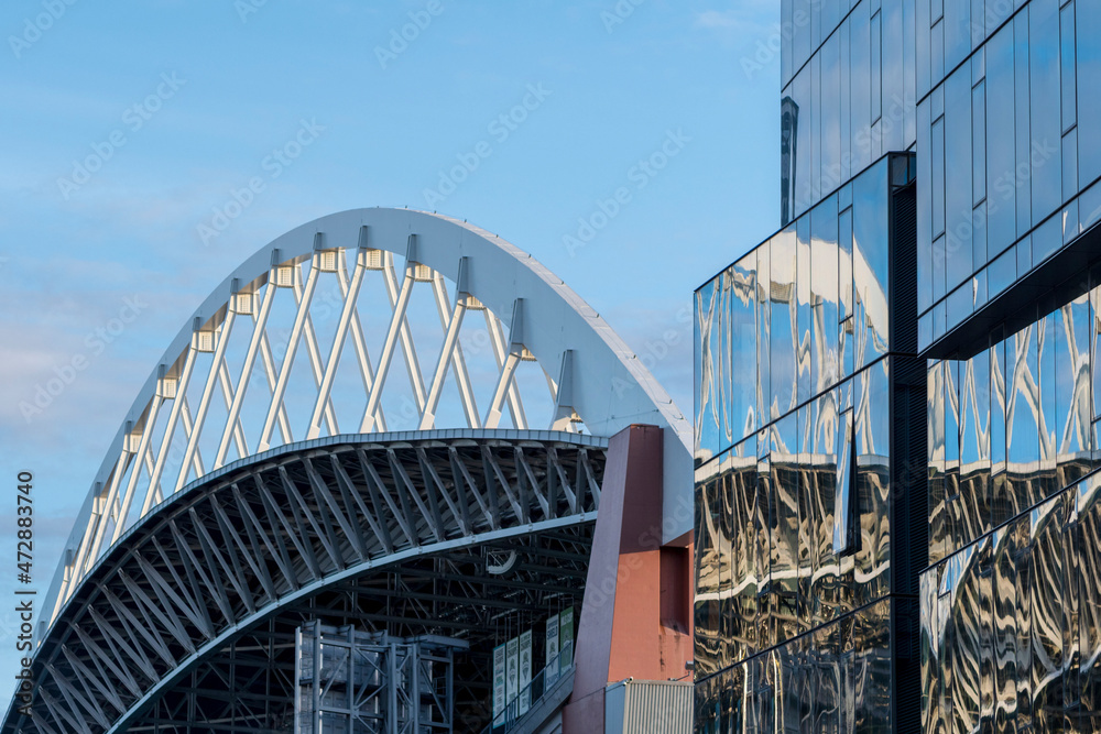 Fototapeta premium Usa, Washington State, Seattle, roof of Safeco Field stadium and glass office tower.