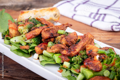 Sweet and spicy chicken with broccoli