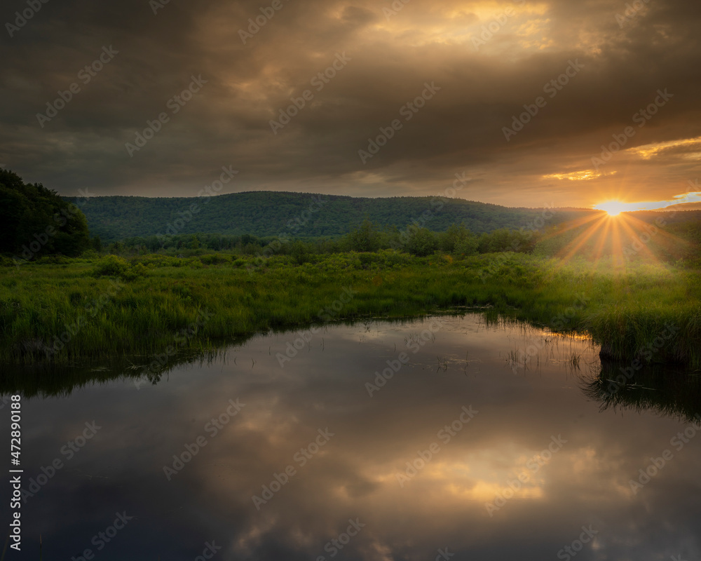 USA, West Virginia, Canaan Valley State Park. Sunset reflection on pond.