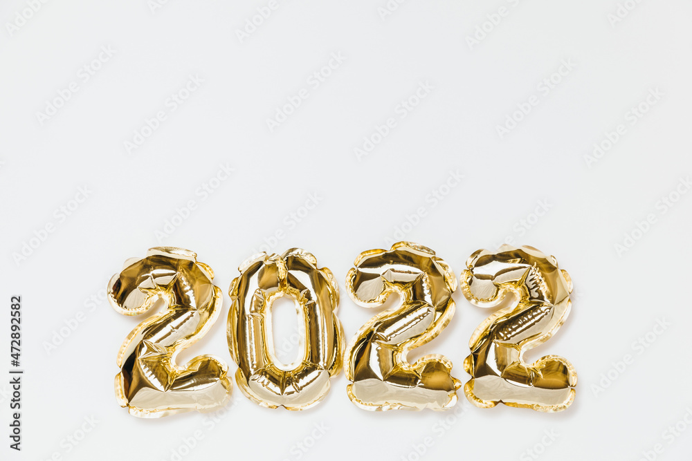 New year 2022 balloon celebration card. Gold foil helium balloon number 2022 isolated on white background. Flat lay, merry christmas, happy holidays mockup.