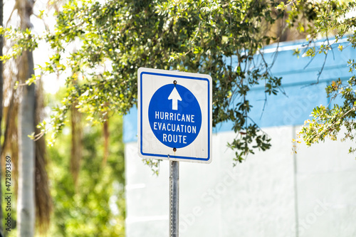 Hurricane evacuation route blue sign to shelter on road arrow direction in West Palm Beach, Florida for safety