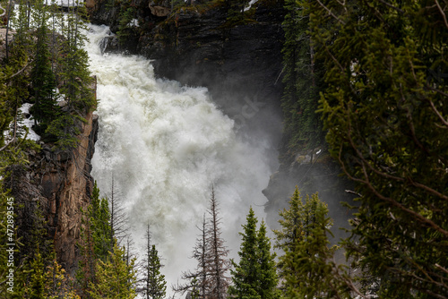 USA, Wyoming, Shoshone National Forest. Spring snow runoff gorges Beartooth Falls. photo