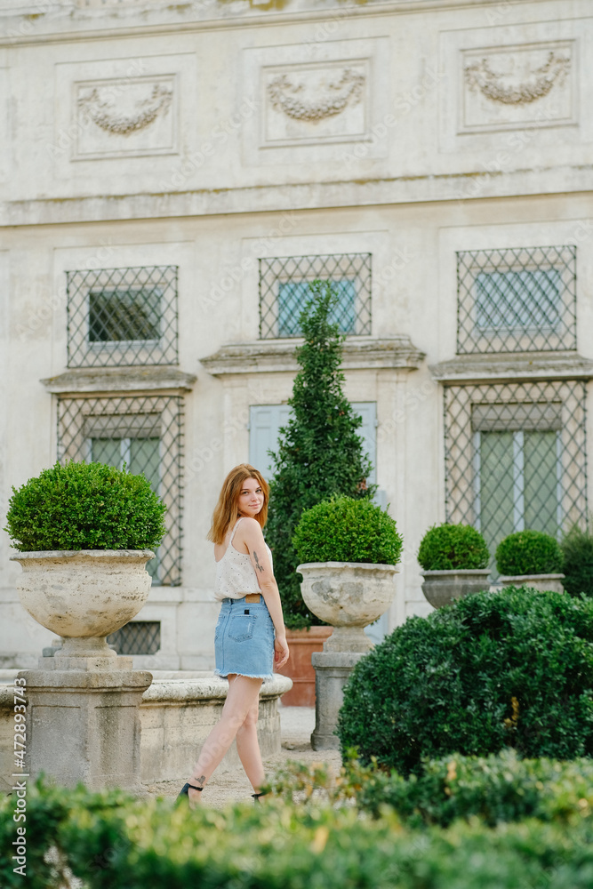 woman in front of a house