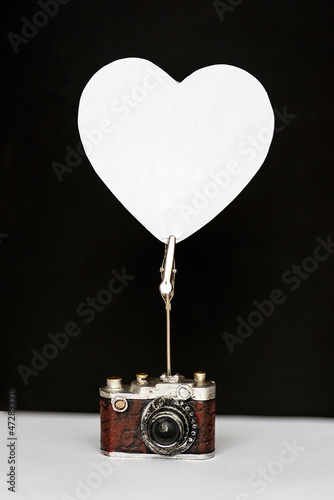 note paper hung on heart shaped note holder photo