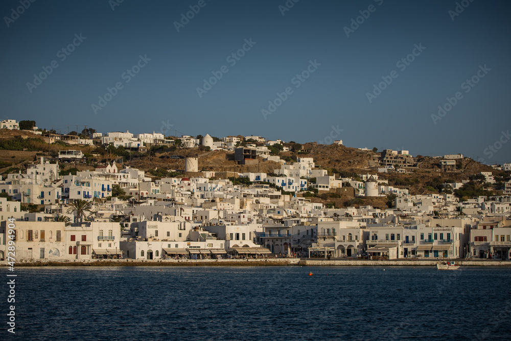 Mykonos, Greece -Summer of 2021 – Typical Greek architecture on a hill. 