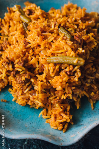 Lubia polo Persian rice dish with ground beef, green beans, turmeric  photo