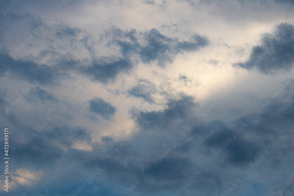 dramatic sky with heavy, gray clouds