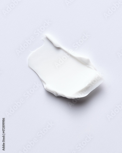 Cosmetics white face cream texture applied with spatula