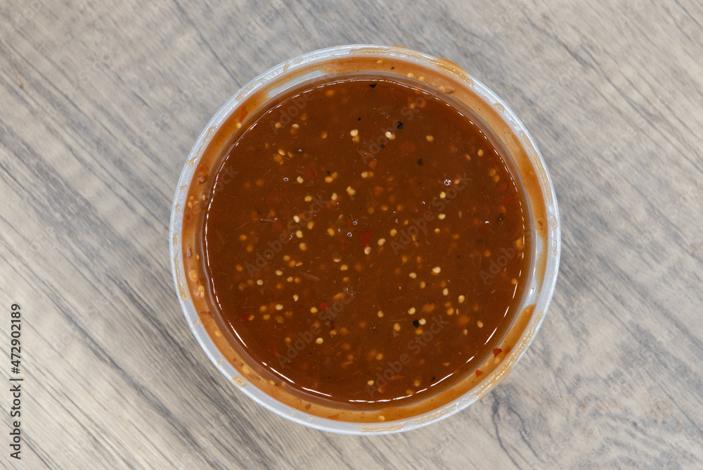 Overhead view of large container of fresh homemade red salsa ready to serve as a dip Overhead view of large container of fresh homemade red salsa ready to serve as a dip