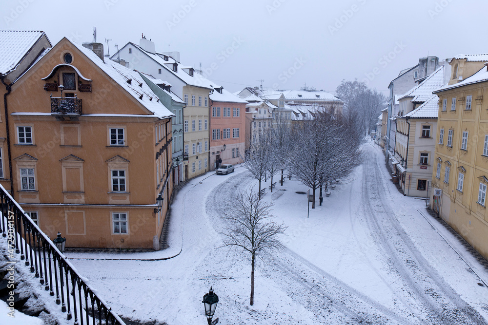 Fototapeta premium Evening snowy Prague Island Kampa above River Vltava, Czech Republic