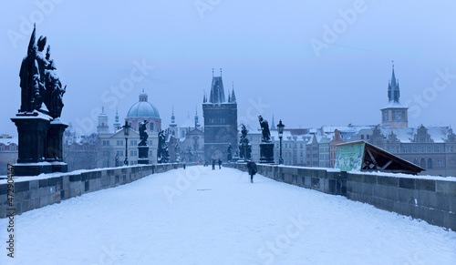 Prague gothic Charles Bridge with its Statues after sunset, Czech Republic