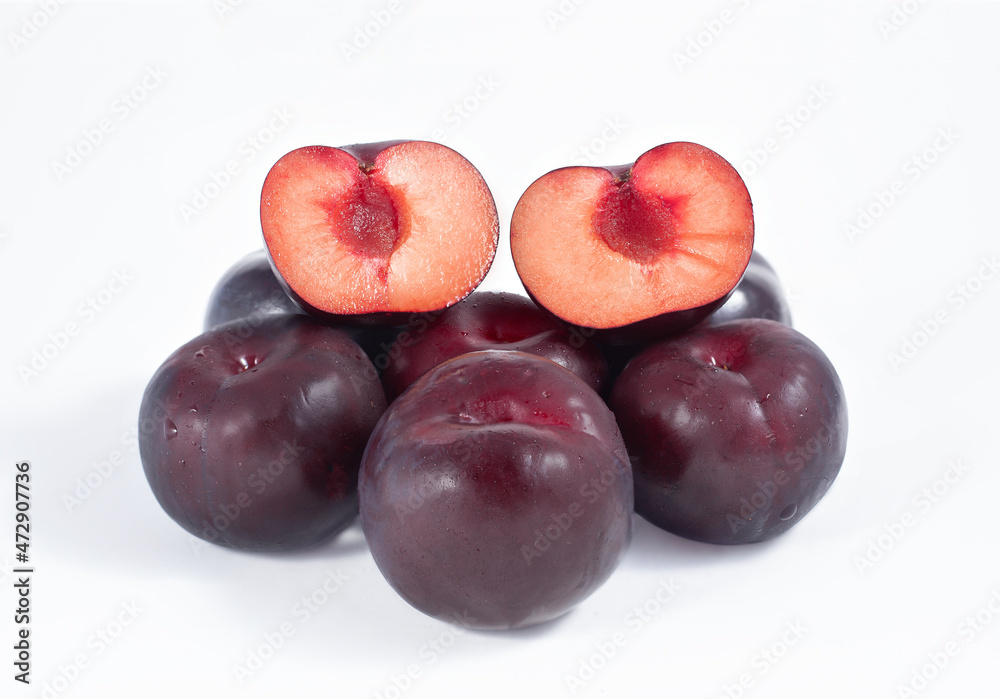 A bunch of plums on a white background.