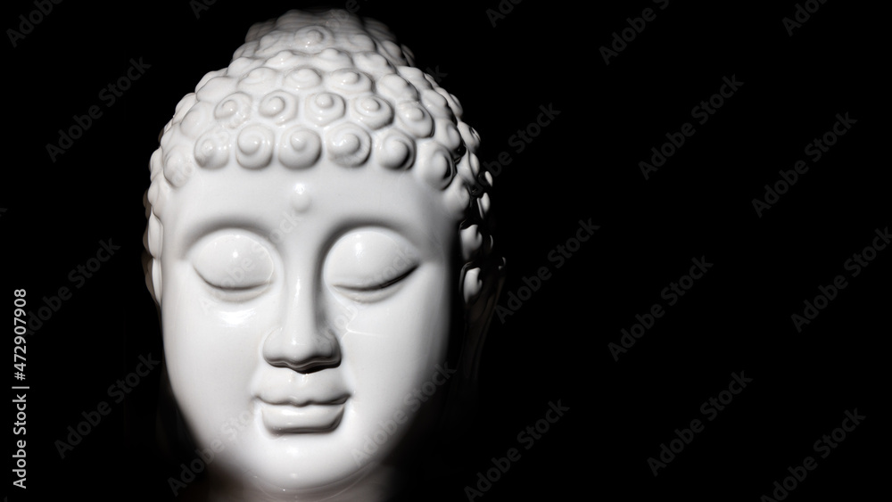 Happy Meditating Budha Statue Black Backgroound