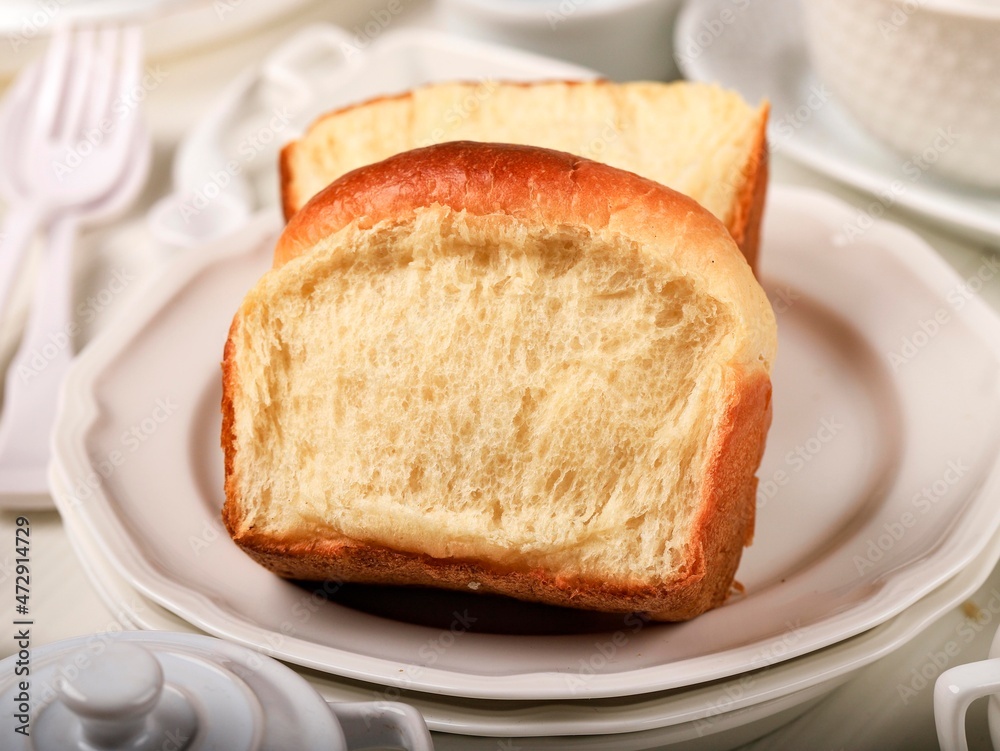 Fresh Baked Sliced Japanese Soft and Fluffy Bun White Bread, Popular as Hokaido Milk Bread . Homemade Japanese Brioche Fresh Baked Sliced Japanese Soft and Fluffy Bun White Bread, Popular as Hokaido Milk Bread . Homemade Japanese Brioche