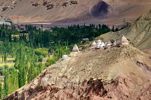 Buddhist Stupas and Rocky landscape of Ladakh, Jammu and Kashmir, India photo