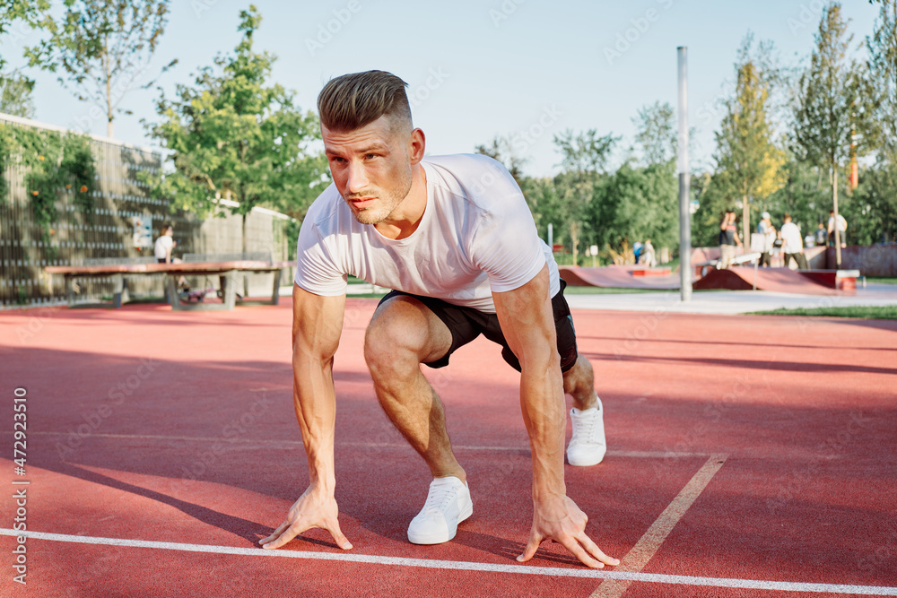 man doing exercises outdoors on the playground man doing exercises outdoors on the playground