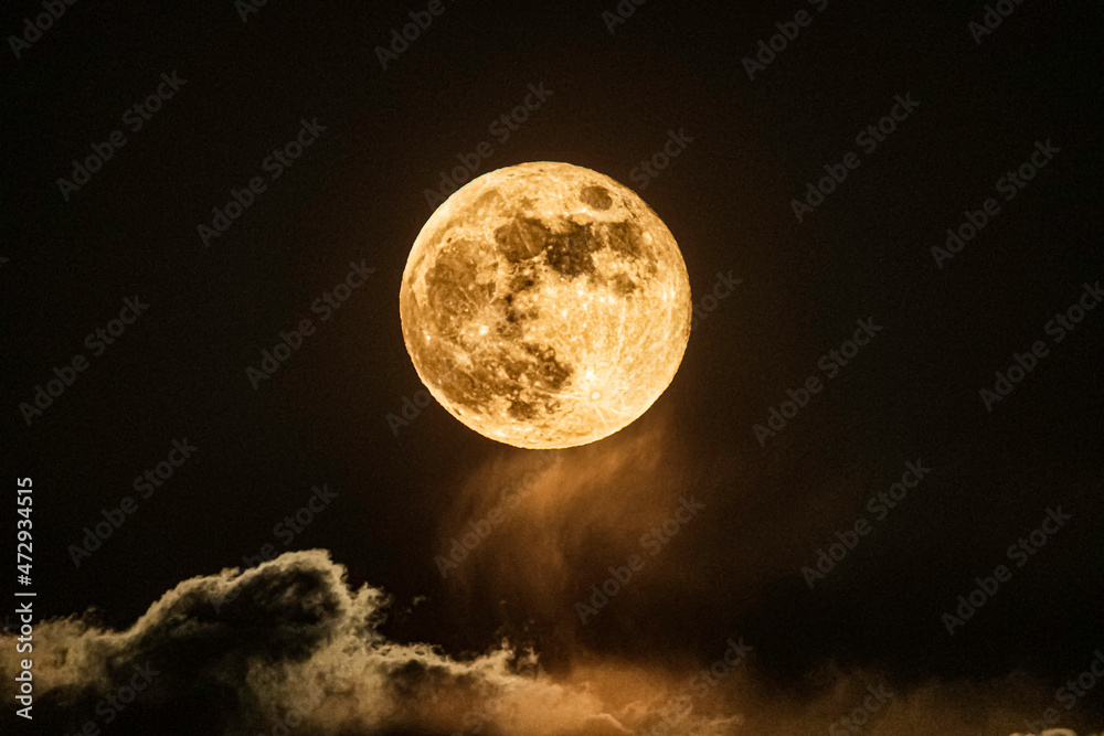 full moon over clouds