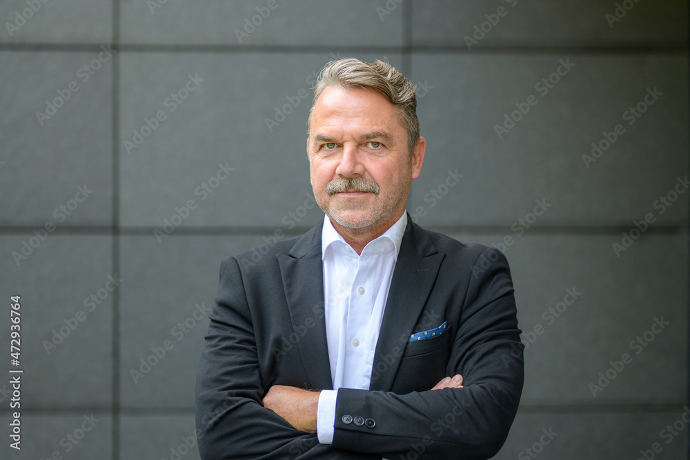 Stylish confident man with folded arms Stylish confident man with folded arms