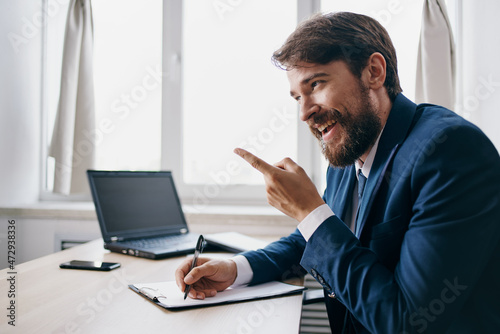manager working for a laptop in the office emotions internet technologies