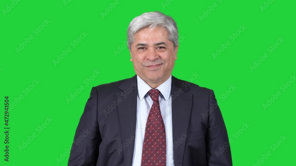 Man in suit laughing at camera.
Man in suit turning looking at camera and laughing. The background color is blue. Man in suit laughing at camera.
Man in suit turning looking at camera and laughing. The background color is blue.