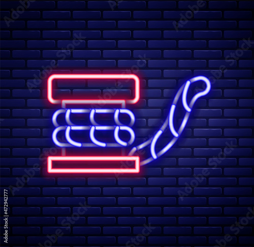 Glowing neon line Marine bollard with rope tied on pier icon isolated on brick wall background. Colorful outline concept. Vector