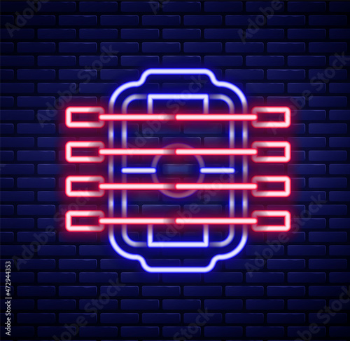 Glowing neon line Table football game hobby or leisure icon isolated on brick wall background. Sport team football players. Colorful outline concept. Vector