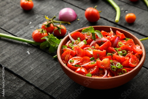 Bowl of healthy diet meal- fresh homemade tomato salad.